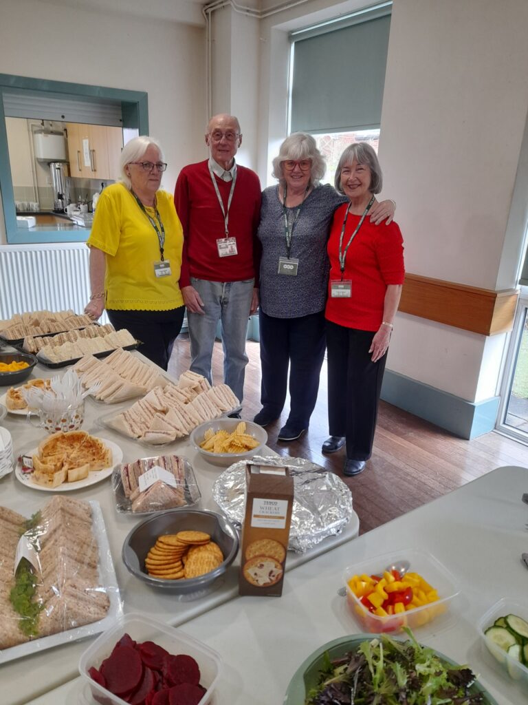 4 hub volunteers stood together