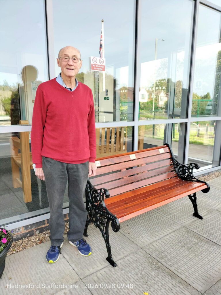 Arthur Roden stood next to bench